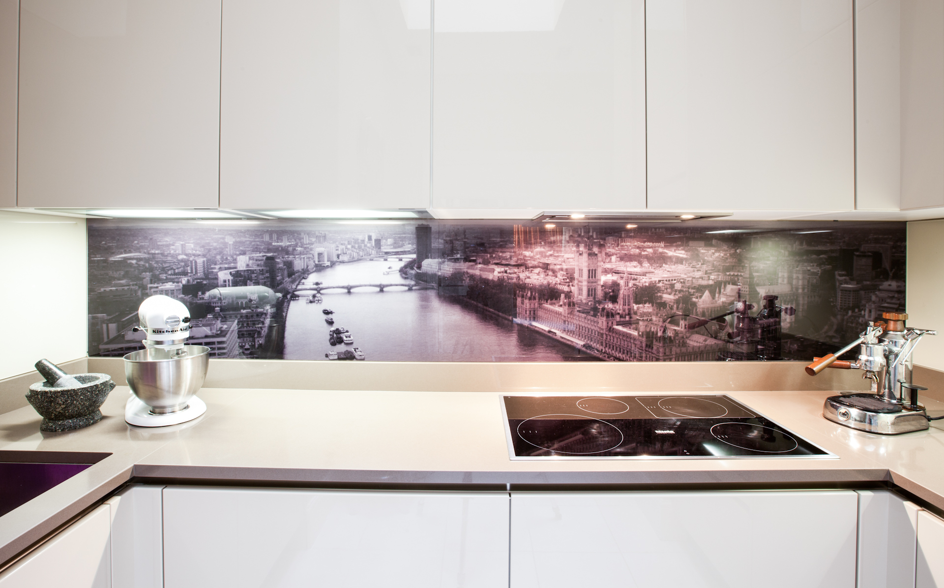 Kitchen with artwork backsplash