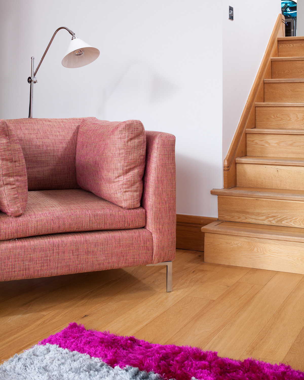 living area and wooden stairs