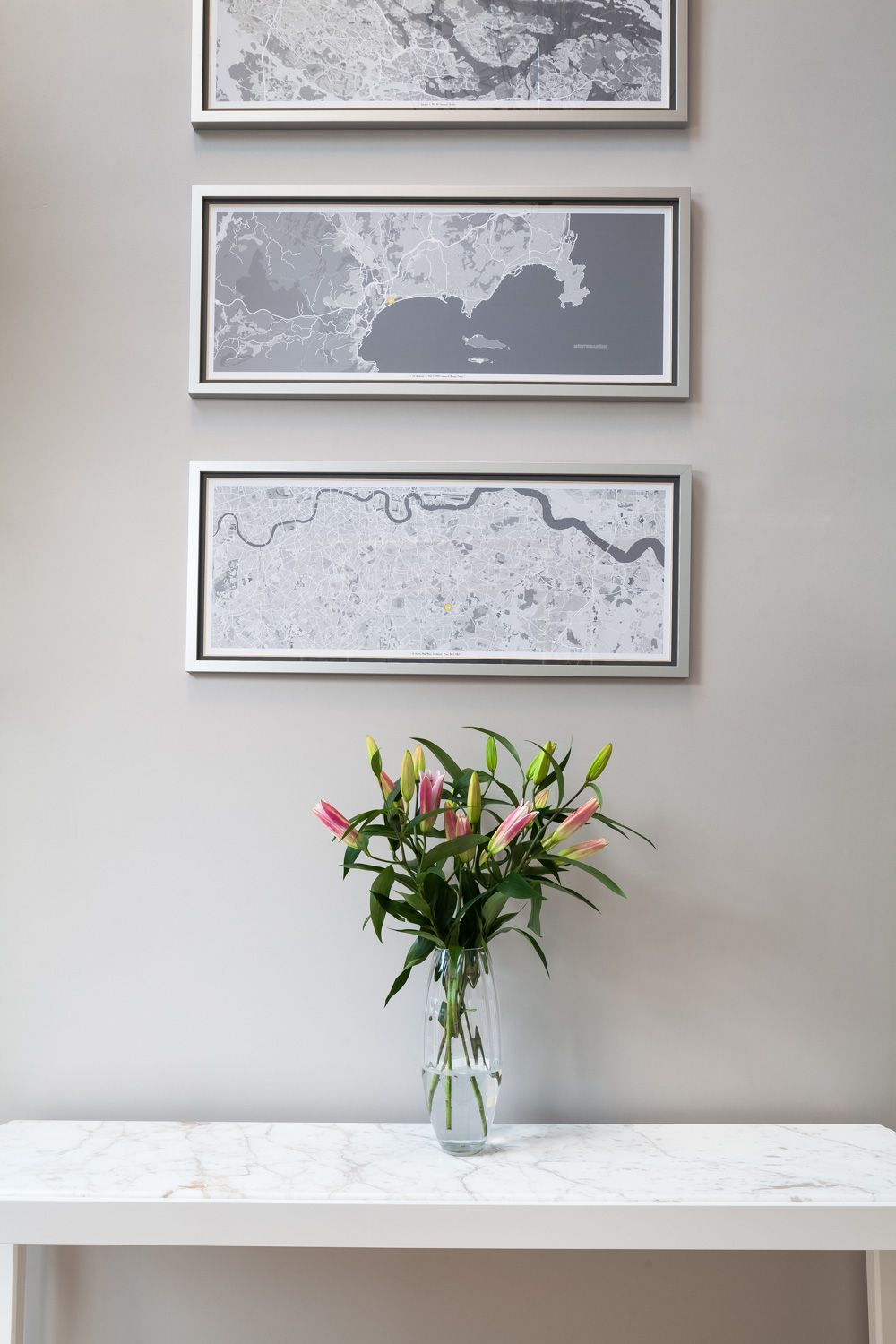 artwork and console table in hallway
