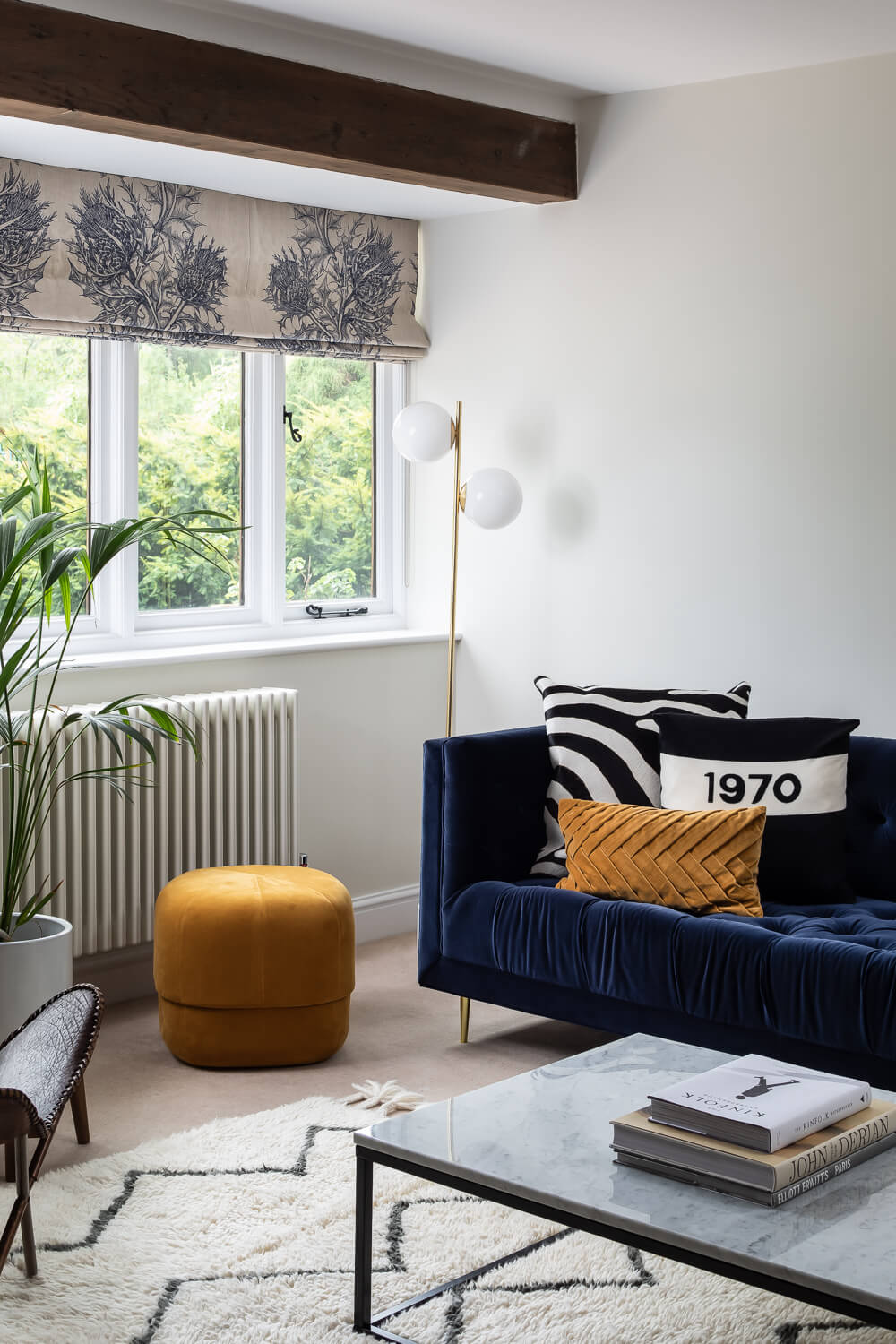 Patterned blinds in lounge with snug decor