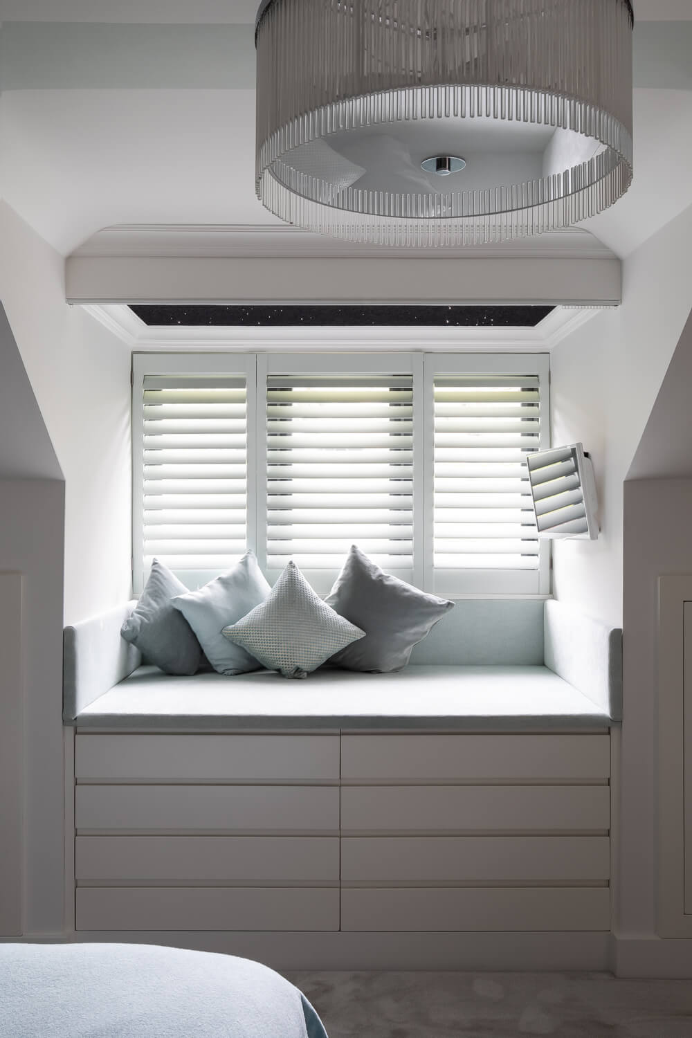 window seat with statement ceiling light