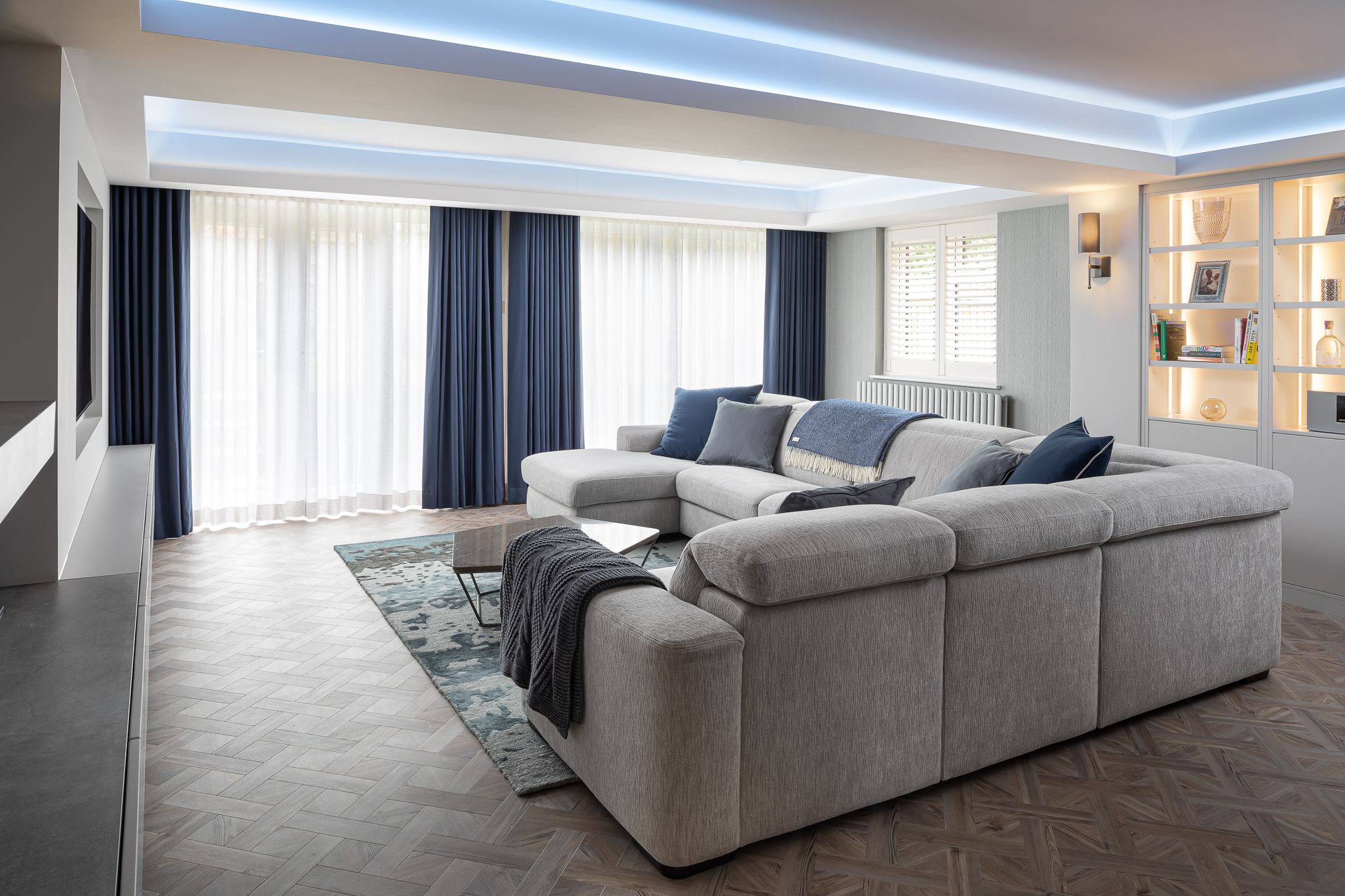 blue themed modern livingroom with corner sofa